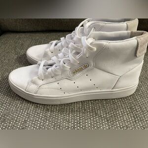 Womens adidas high top tennis shoes.